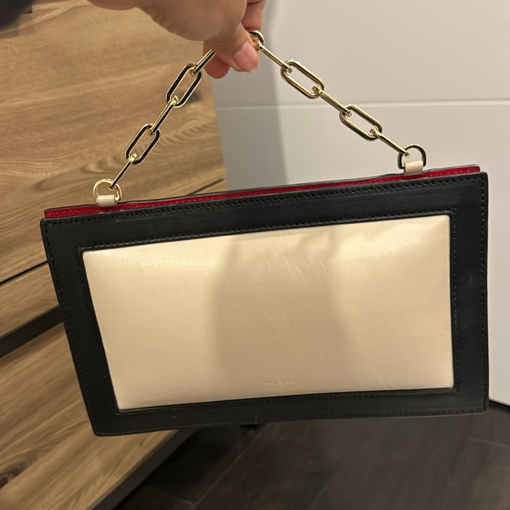 The Sant Black and white leather clutch